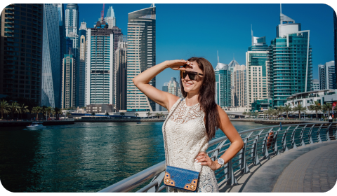 Photo of an expat smiling and looking at the views of Dubai Marina
